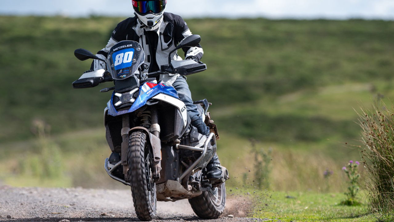A BMW R1300 GS sliding on gravel 